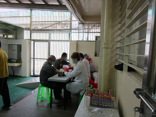 Medical technologists conduct to draw blood samples on new inmates